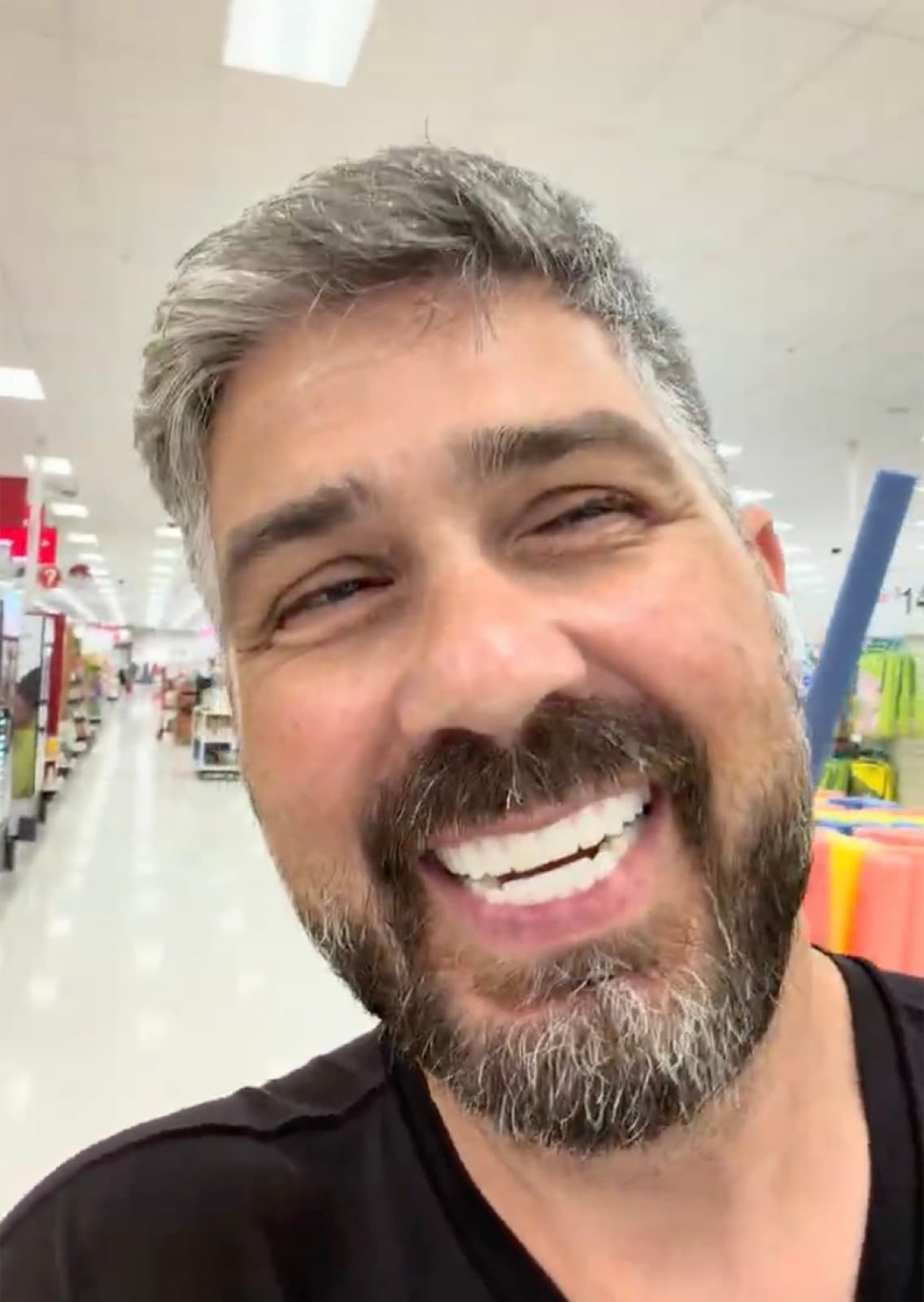John smiling confidently with his new teeth after his dental implant treatment